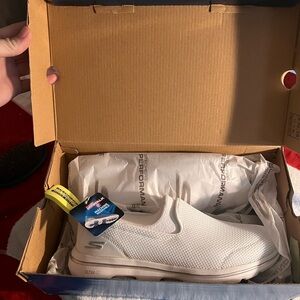 Skechers women’s White Slip-On Sneakers